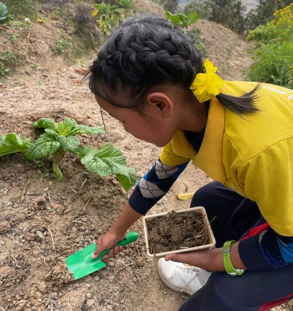 global-guardians-nepal-girl-planting